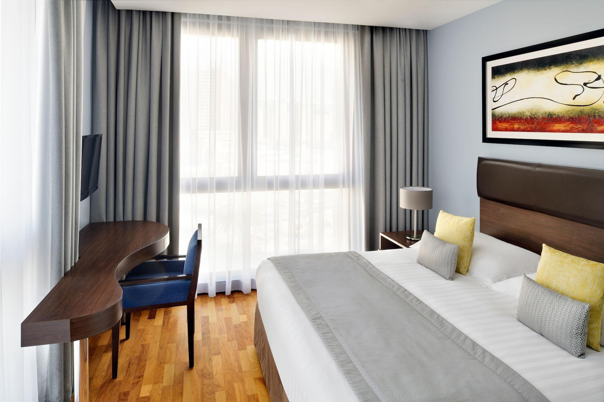 Moevenpick Hotel Apartments Al Mamzar דובאי מראה חיצוני תמונה A typical room at the hotel